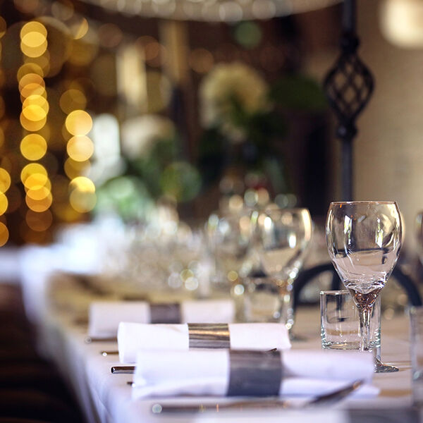 Glasses and napkins set up on a long table