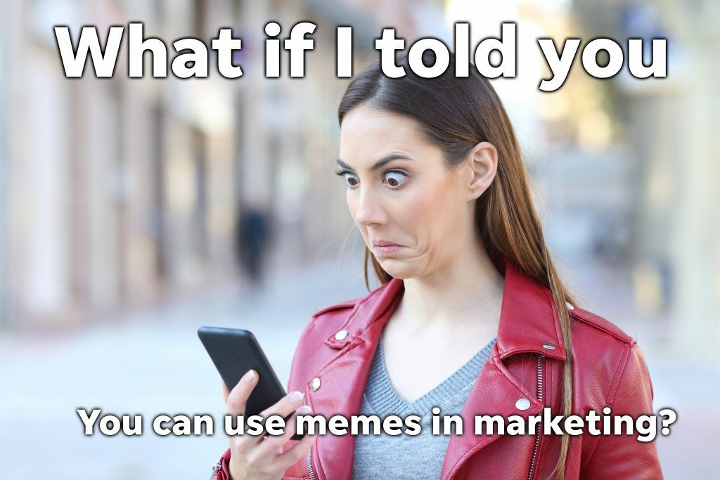 woman looking at her phone with a shocked expression with the words "what if I told you, you can use memes in marketing?"